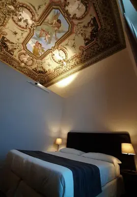 Letto o letti in una camera di Hotel Palazzo Vannoni
