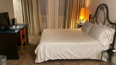 Letto o letti in una camera di Relais Cascina Scottina