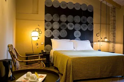 Letto o letti in una camera di Relais Cascina Scottina