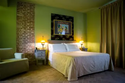 Letto o letti in una camera di Relais Cascina Scottina