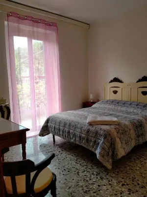 Letto o letti in una camera di Affittacamere DA MARIA TERESA