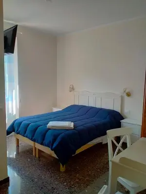 Letto o letti in una camera di Affittacamere DA MARIA TERESA