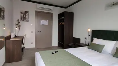 Letto o letti in una camera di Suites Direzionale Carpi