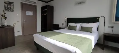 Letto o letti in una camera di Suites Direzionale Carpi