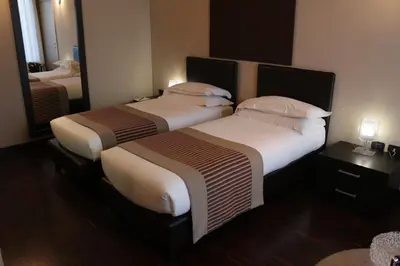 Letto o letti in una camera di OneMhotel