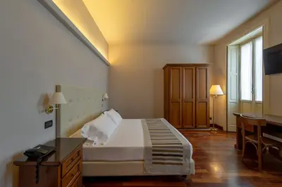 Letto o letti in una camera di Hotel Antica Dimora, MantegnaHotels