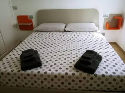 Letto o letti in una camera di Casa Artemisia
