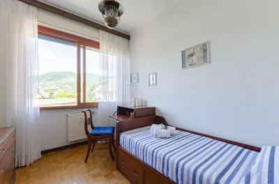 Letto o letti in una camera di JOIVY Apartment in Rapallo with gulf view
