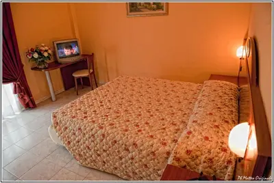 Letto o letti in una camera di Demy Hotel