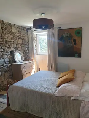 Letto o letti in una camera di Maison de village avec piscine au-dessus des Cinque Terre