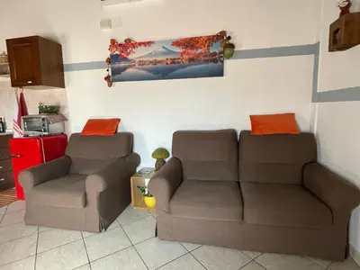 Area soggiorno di Independent Little Loft in Modena