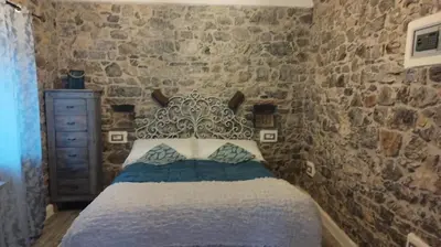 Letto o letti in una camera di La pietra di Sersa