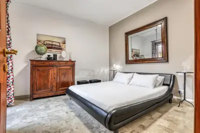 Letto o letti in una camera di ANGOLO DI CORSO CAVOUR - Ultimo piano centrale e luminoso