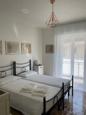 Letto o letti in una camera di Casa Gelindo - large and fine apartment with two bathrooms