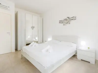 Letto o letti in una camera di Nour Apartments - Castramajora Alloggi