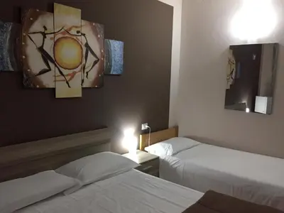 Letto o letti in una camera di Residence albergo SELF CHECK-IN
