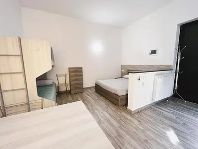 Letto o letti in una camera di Monolocale con posto auto