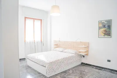 Letto o letti in una camera di 083 - Casa Grande con Attico condominiale vista mare, 500 metri dalla spiaggia