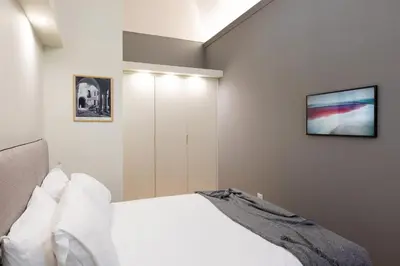 Letto o letti in una camera di Palazzo Liberati Apartments - Manu Maison
