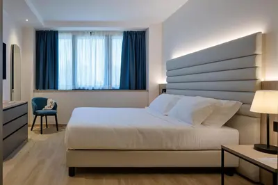 Letto o letti in una camera di RMH Modena Raffaello