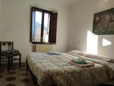 Letto o letti in una camera di Il ristoro del viandante