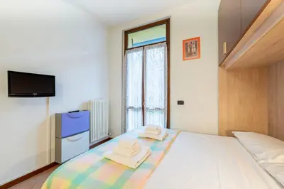 Letto o letti in una camera di GuestHost - Parma Historic Center Apartment 7min from Duomo