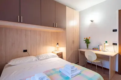 Letto o letti in una camera di GuestHost - Parma Historic Center Apartment 7min from Duomo