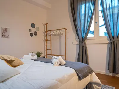 Letto o letti in una camera di Maison Blanche: appartamento elegante con parcheggio privato