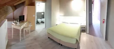 Letto o letti in una camera di Affittacamere ADELPHIA