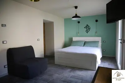 Letto o letti in una camera di Antica Locanda Bonfiglio