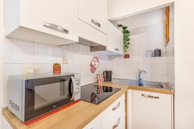 Cucina o angolo cottura di City Center Piazza Pomposa Suite