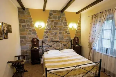 Letto o letti in una camera di Agriturismo dal nonno Merico