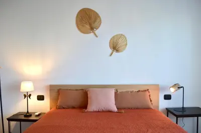 Letto o letti in una camera di Cosy Home Riviera Wi-fi, AC, terrace 3 BDR
