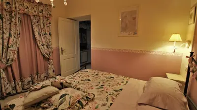Letto o letti in una camera di La casina dei cuori di nonna Miglia