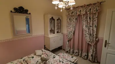 Letto o letti in una camera di La casina dei cuori di nonna Miglia