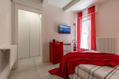 Letto o letti in una camera di Suite Modena al Centro - Affitti Brevi Italia