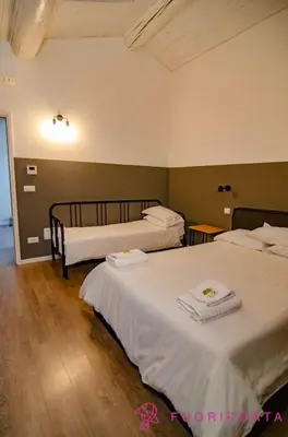 Letto o letti in una camera di FuoriPorta Affitti Brevi - Corte 2 con parcheggio gratuito