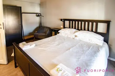 Letto o letti in una camera di FuoriPorta Affitti Brevi - Corte 3 con parcheggio gratuito