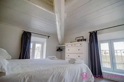 Letto o letti in una camera di FuoriPorta Affitti Brevi - Corte 4 con parcheggio gratuito