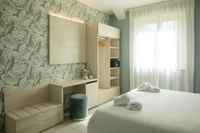 Letto o letti in una camera di Lei Rooms