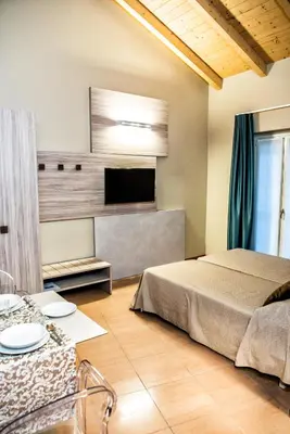 Letto o letti in una camera di CallMe Crema - Struttura in centro storico