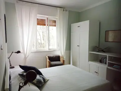 Letto o letti in una camera di ALMA Vacanza