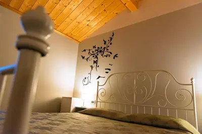 Letto o letti in una camera di Appartamento incantevole con parcheggio privato