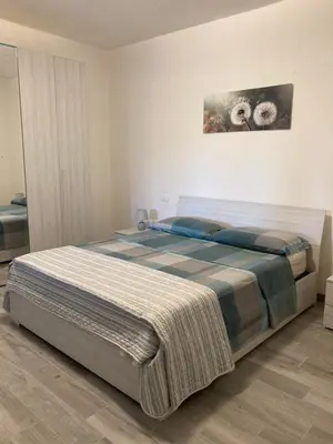 Letto o letti in una camera di La casa nel verde con piscina