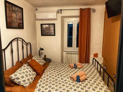 Letto o letti in una camera di La Casa Rossa Arcola Con Vista