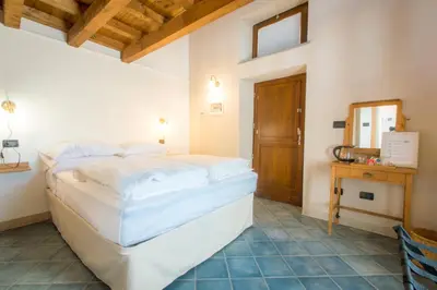 Letto o letti in una camera di Ca' di Martino