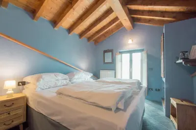 Letto o letti in una camera di Ca' di Martino
