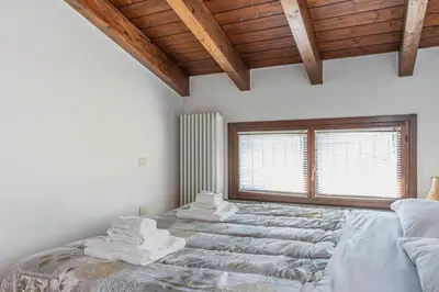 Letto o letti in una camera di GuestHost - Parma Parco Ducale Duplex Apartment with parking