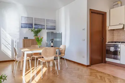 Cucina o angolo cottura di GuestHost - Parma Parco Ducale Duplex Apartment with parking