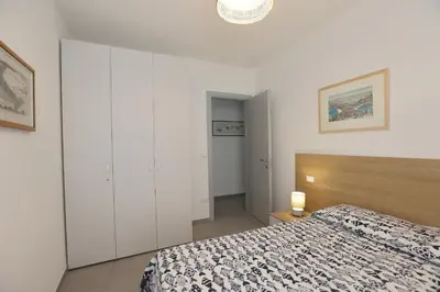 Letto o letti in una camera di Adamaina - Sea view apartment with private garage